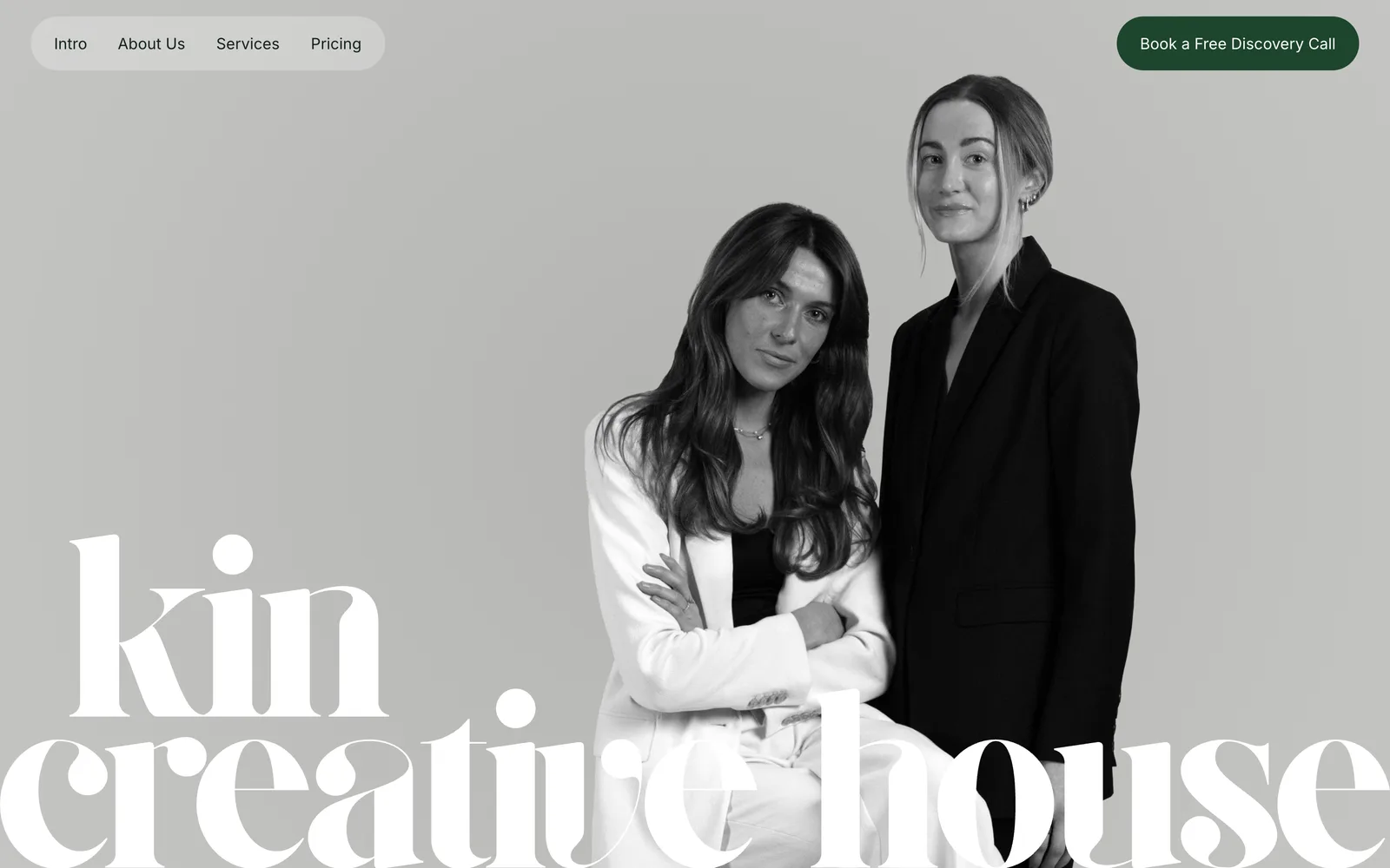 The Kin Creative House homepage, a black and white portrait of the two founders over the studio wordmark.